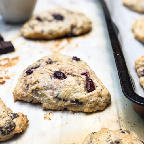 Learn how to make sourdough scones! Buttery scones studded with sweet cherries and semisweet chocolate make for a wonderful breakfast or teatime treat. A cup of sourdough discard adds a perfect tangy background to the medley of flavors.