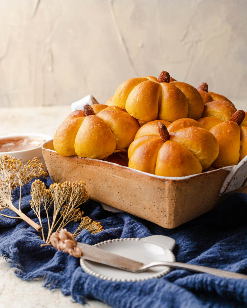 basket of pumpkin bread rolls