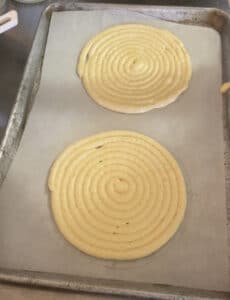 Piping round ladyfinger sponges