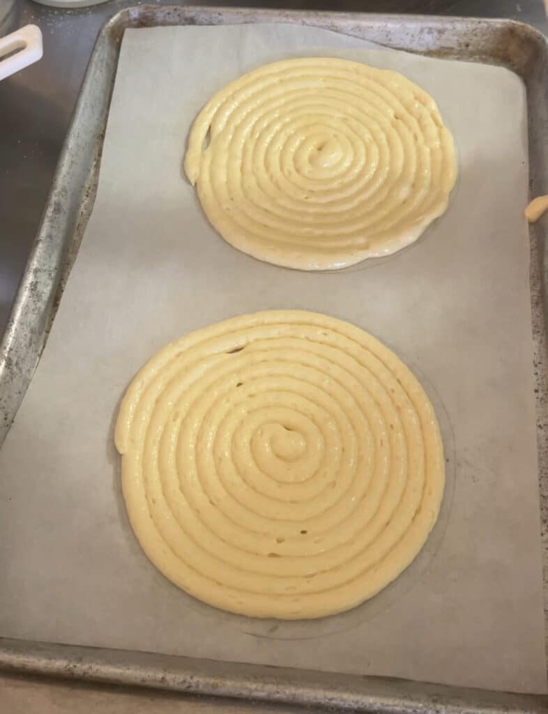 Piping round ladyfinger sponges